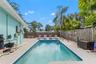 Spacious pool area with plenty of room for lounge chairs, outdoor seating, and entertaining.