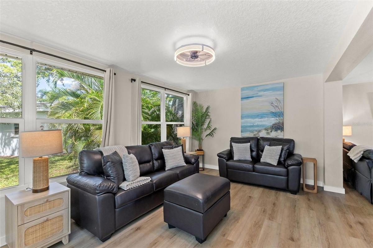 The home’s single-story layout offers generous, connected living spaces with updated flooring and a bright, neutral interior.