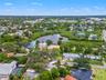 Aerial view of the surrounding Ozona neighborhood, with waterfront homes, natural waterways, and marinas nearby.