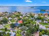 Ozona’s unique setting comes into view, with nearby waterfront neighborhoods and the open waters of St. Joseph Sound beyond.