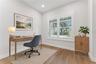 Virtually Staged - Paired shuttered windows bring natural light into this first floor office.