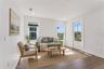 Virtually Staged - Tall windows and a glazed exterior door bring light into this room.