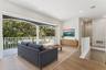 Virtually Staged - The loft offers natural light, recessed lighting, and a view of the staircase.