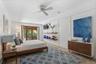 Located on the lower level, this bedroom has been virtually staged to showcase the warmth and charm of the space—an inviting  space for guests or mult