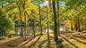 The view from your main deck showcases the tranquil river framed by the lush greenery surrounding the property—a peaceful backdrop for relaxing and en