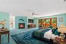 Virtually staged to highlight its generous proportions, the primary bedroom is filled with inviting color, natural light, and warmth, creating a seren