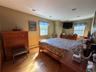 South east exposure in this primary bedroom, oak floors