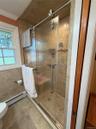 Main level full bath, walk-in  shower, glass  enclosed
