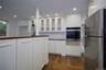 Kitchen featuring glass insert cabinets, stainless steel appliances, wooden counters, dark wood-style flooring, and recessed lighting