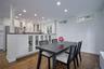 Dining room featuring recessed lighting, dark wood finished floors, and radiator