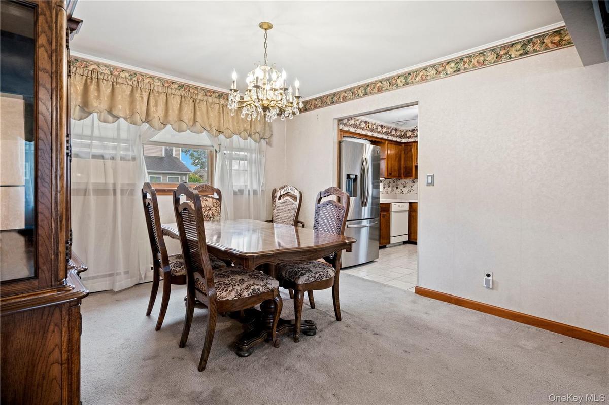The dining room is close to both the kitchen and living room, making it very convenient when hosting guests.