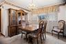 Both the dining room & living room are carpeted, but hardwood floors exist under the carpeting throughout the entire main floor.