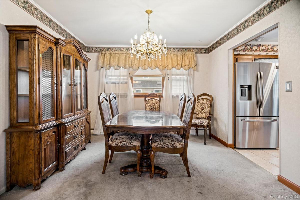 The formal dining room is spacious enough for a large dining table.