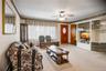Looking from the dining room towards the living room, front door & coat closet.