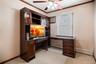 The 2nd bedroom is in the middle of the hallway and was used as the home office.