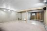 The area to the left of the stairs has multiple closets & an outside entrance.