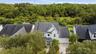 The nature preserve behind this home offers peace & privacy