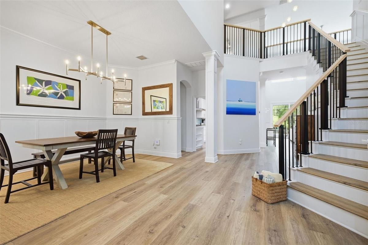Bright & airy 2 story foyer opens up to the dining room on the left & office on the right