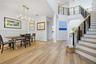 Bright & airy 2 story foyer opens up to the dining room on the left & office on the right
