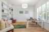 Private office with french doors & built in shelving