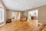 Entry to Upstairs and Living Room to Kitchen