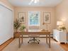 Bedroom setup as office virtually staged