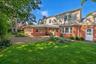 Rear View Of This Brick Styled Cape Cod Home