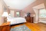 Large Primary Bedroom - Bright & Sunny with Great Space and Beautiful Hardwood Floors