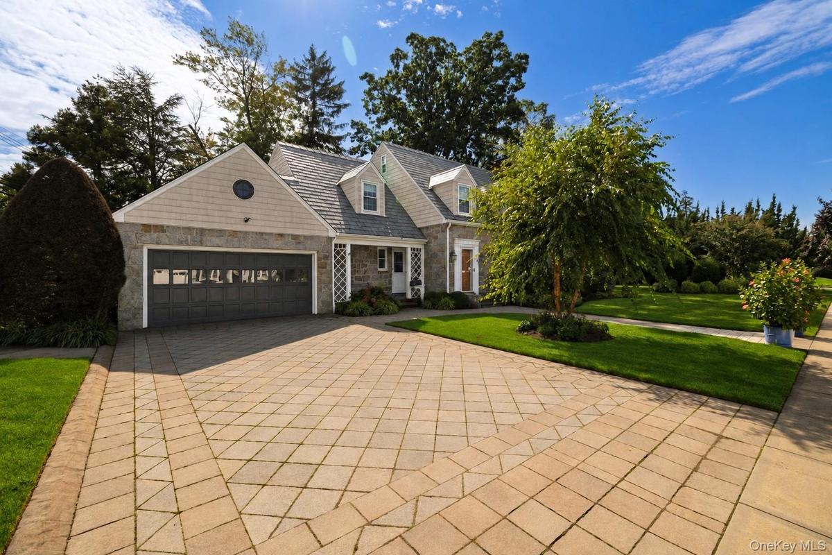 Large Double Paver Driveway With A Two-Car Garage