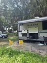 RV: 20 feet awning over paved area. Outside TV plus kitchen / cooking