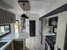 RV: Through view from kitchen with powder room to steps to master bedroom with en suite bathroom