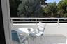 Royal Suite West balcony dining overlooking the second gate and a paddock fenced area