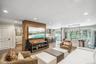 Open-concept living space featuring wood-finish flooring and recessed lighting