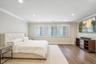 Recessed lighting, crown molding, wood-finish flooring, and multiple windows with blinds
