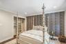 Recessed lighting, crown molding, wood-finish flooring, custom closet shelving, and a patterned accent wall