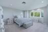 Bedroom 2, recessed lighting, large bay window, light grey wall paint, grey carpet, and window blinds and views