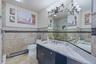 Dual vanity with undermount sinks and light-toned, quartzite countertops