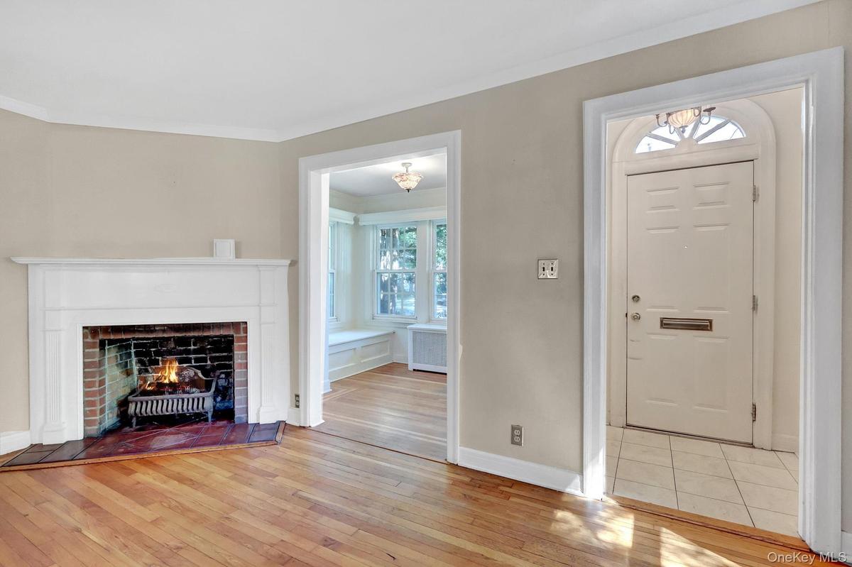 Non Staged Living room showing den and Foyer