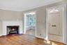 Non Staged Living room showing den and Foyer