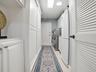 THE LAUNDRY ROOM HAS A NEW FRONT LOAD WASHER AND DRYER, A SINK, AND ALL THE CABINET SPACE YOU SEE HAS BEEN ADDED OFFERING SO MUCH EXTRA STORAGE. AN AR