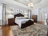 TO THE RIGHT IS THE HALLWAY LEADING TO YOUR EN-SUITE BATH WITH SPACIOUS CLOSETS AND BUILT-INS!