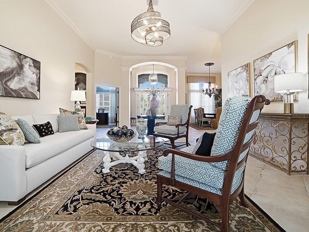 LOOKING BACK AT THE FOYER WITH THE FORMAL DINING ROOM TO THE RIGHT.