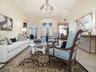 LOOKING BACK AT THE FOYER WITH THE FORMAL DINING ROOM TO THE RIGHT.