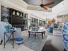 WHAT A BEAUTIFUL FAMILY ROOM WITH CUSTOM BRICK WALL SURROUNDING THE BUILT IN WALL UNIT AND CABINETS.