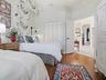 THIS ROOM ALSO HAS A DOUBLE DOOR CLOSET WITH BUILT-INS.