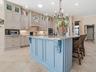 AROUND THE CORNER FROM THE DINING ROOM, YOU'LL FIND THE COMPLETELY RENOVATED, STUNNING KITCHEN.