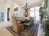 GREAT FOR ENTERTAINING WITH BEAUTIFUL CHANDELIER, VALANCE AND CUSTOM DRAPES.
