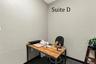 Suite D has a high window and is located near the hall restroom and Covered Patio Break Common Area