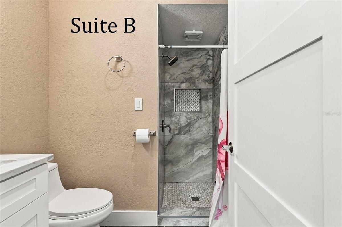 Double Glass Doors into Suite B, with Private Full Bathroom, Window to the Front of the Office, located by the Lobby
