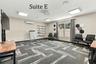 Suite E has a private entrance, large window overlooking the landscaping, a private restroom and has access to the Covered Patio Break Area